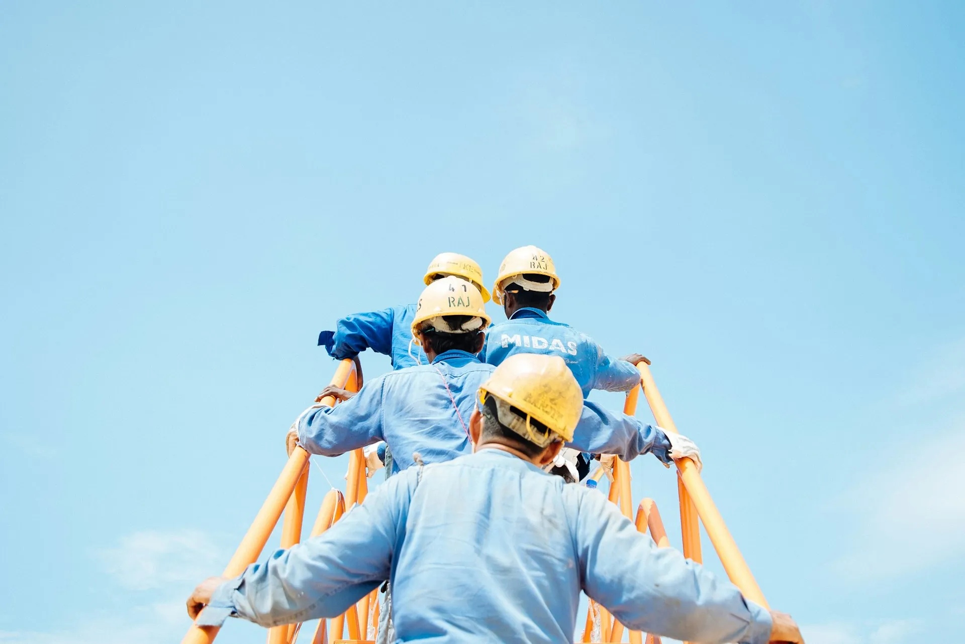 Kaizen Spire crew on a structural steel beam